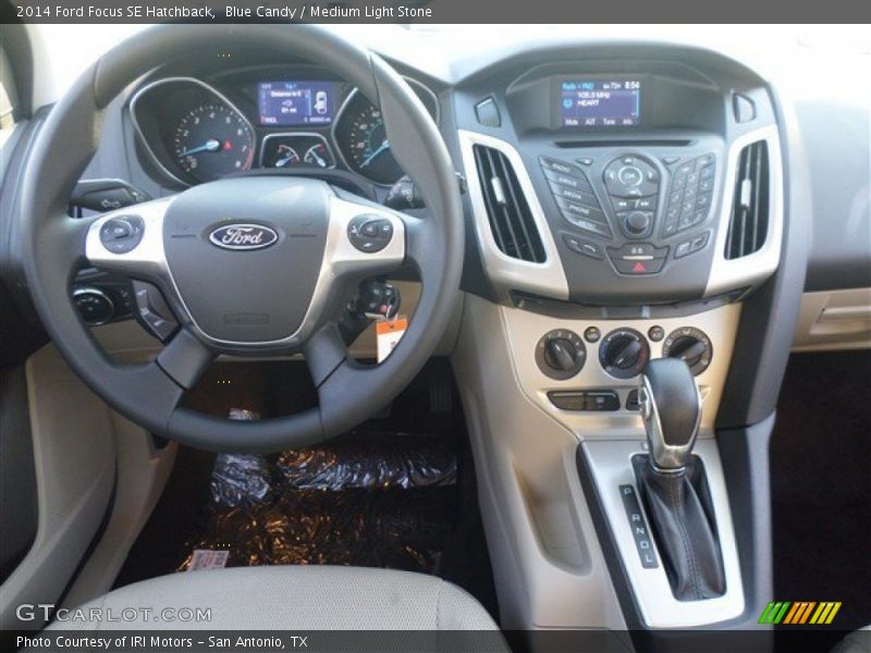 Blue Candy / Medium Light Stone 2014 Ford Focus SE Hatchback