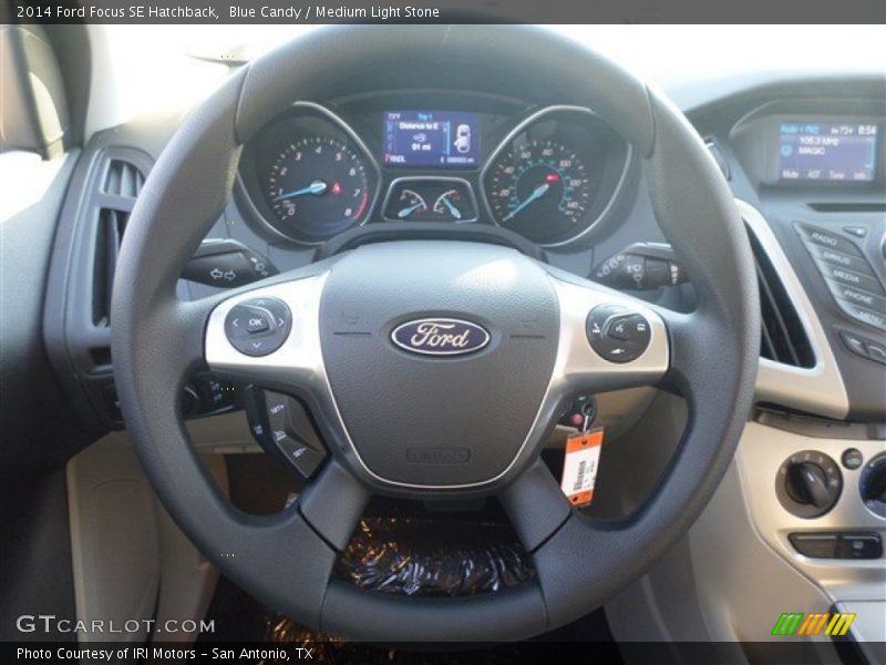 Blue Candy / Medium Light Stone 2014 Ford Focus SE Hatchback