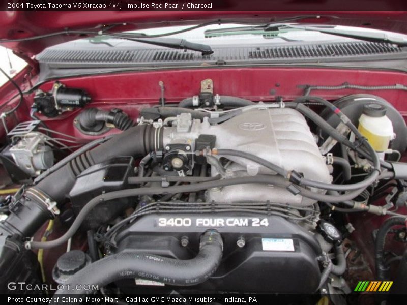 Impulse Red Pearl / Charcoal 2004 Toyota Tacoma V6 Xtracab 4x4