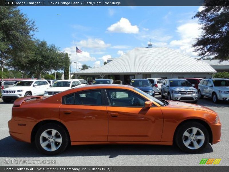 Toxic Orange Pearl / Black/Light Frost Beige 2011 Dodge Charger SE
