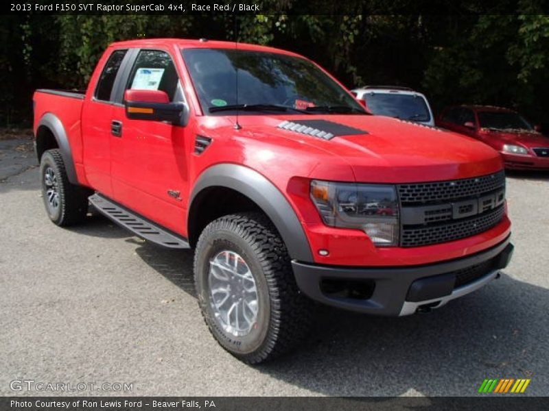 Front 3/4 View of 2013 F150 SVT Raptor SuperCab 4x4