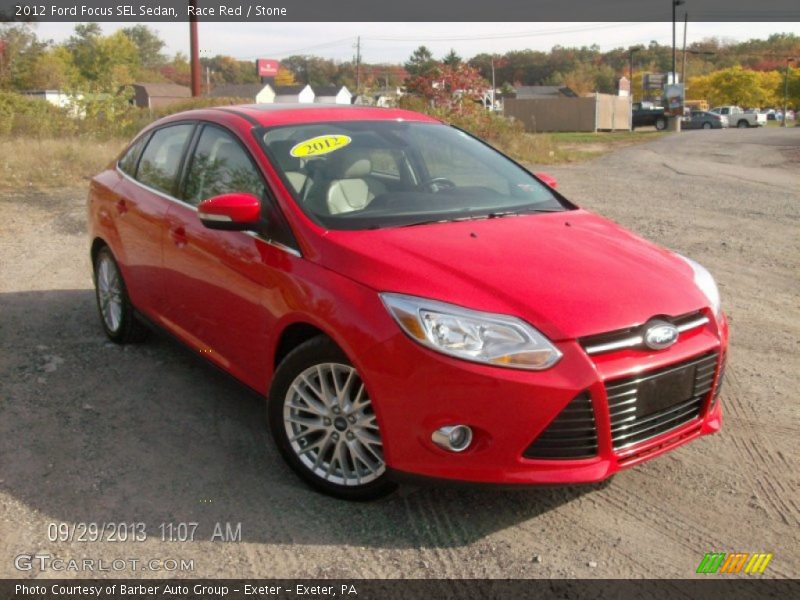 Race Red / Stone 2012 Ford Focus SEL Sedan