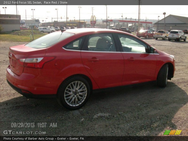 Race Red / Stone 2012 Ford Focus SEL Sedan