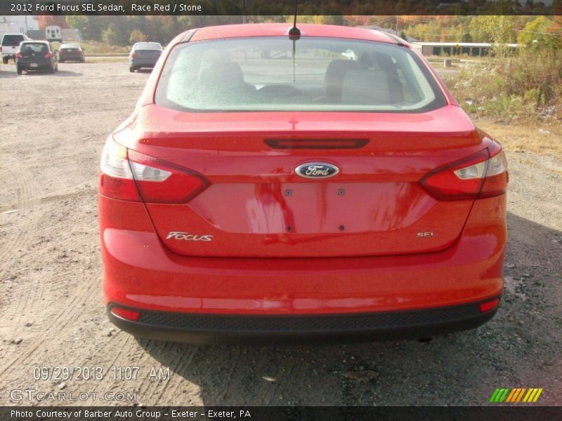 Race Red / Stone 2012 Ford Focus SEL Sedan