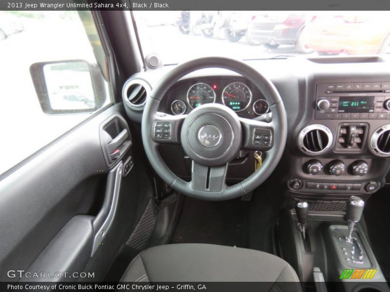 Black / Black 2013 Jeep Wrangler Unlimited Sahara 4x4