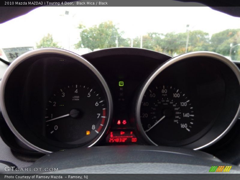 Black Mica / Black 2010 Mazda MAZDA3 i Touring 4 Door