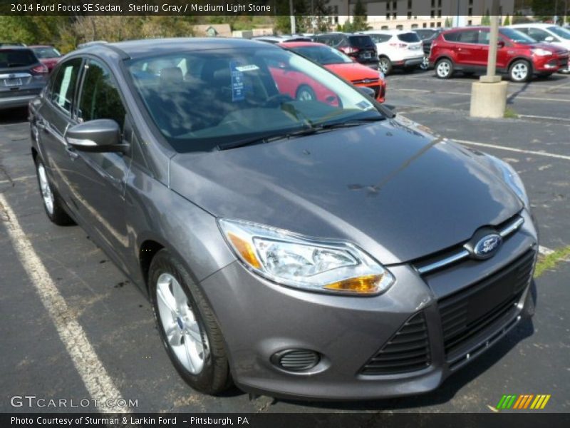 Sterling Gray / Medium Light Stone 2014 Ford Focus SE Sedan