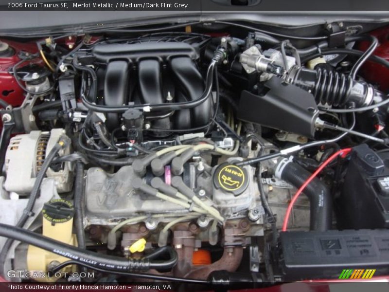 Merlot Metallic / Medium/Dark Flint Grey 2006 Ford Taurus SE