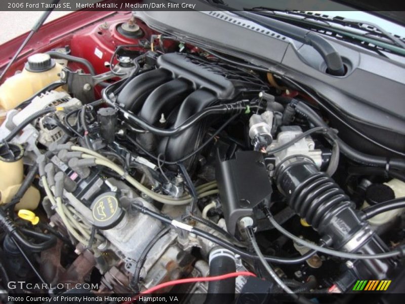 Merlot Metallic / Medium/Dark Flint Grey 2006 Ford Taurus SE