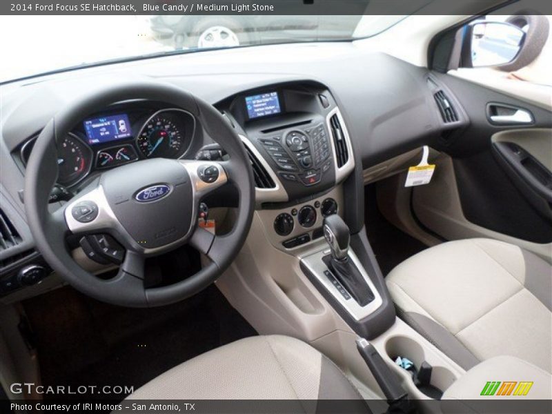 Blue Candy / Medium Light Stone 2014 Ford Focus SE Hatchback