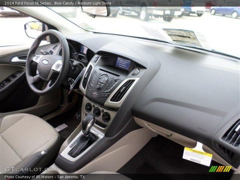 Blue Candy / Medium Light Stone 2014 Ford Focus SE Sedan
