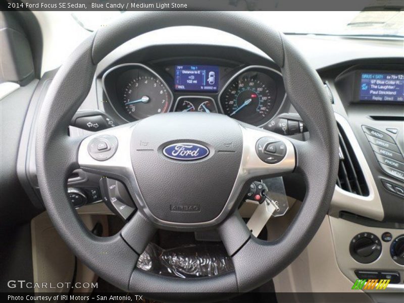 Blue Candy / Medium Light Stone 2014 Ford Focus SE Sedan