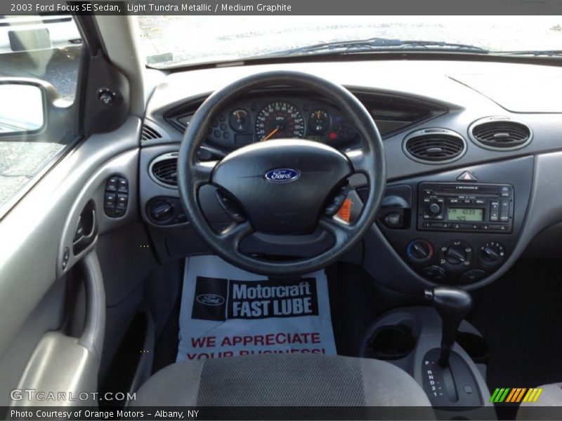 Light Tundra Metallic / Medium Graphite 2003 Ford Focus SE Sedan