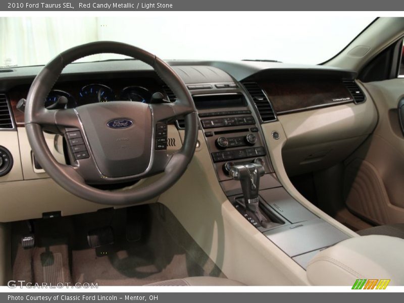 Red Candy Metallic / Light Stone 2010 Ford Taurus SEL