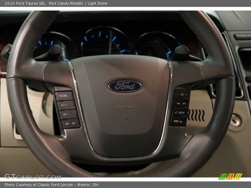 Red Candy Metallic / Light Stone 2010 Ford Taurus SEL