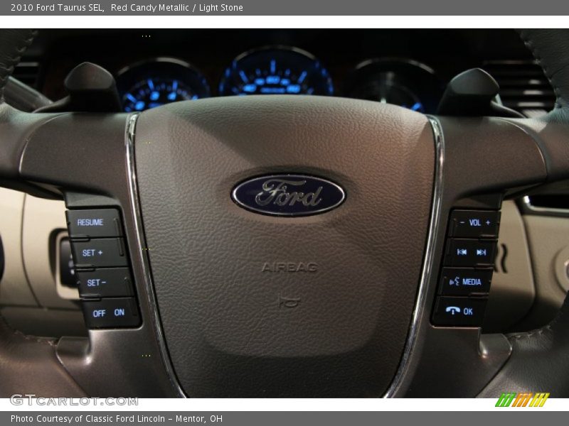 Red Candy Metallic / Light Stone 2010 Ford Taurus SEL