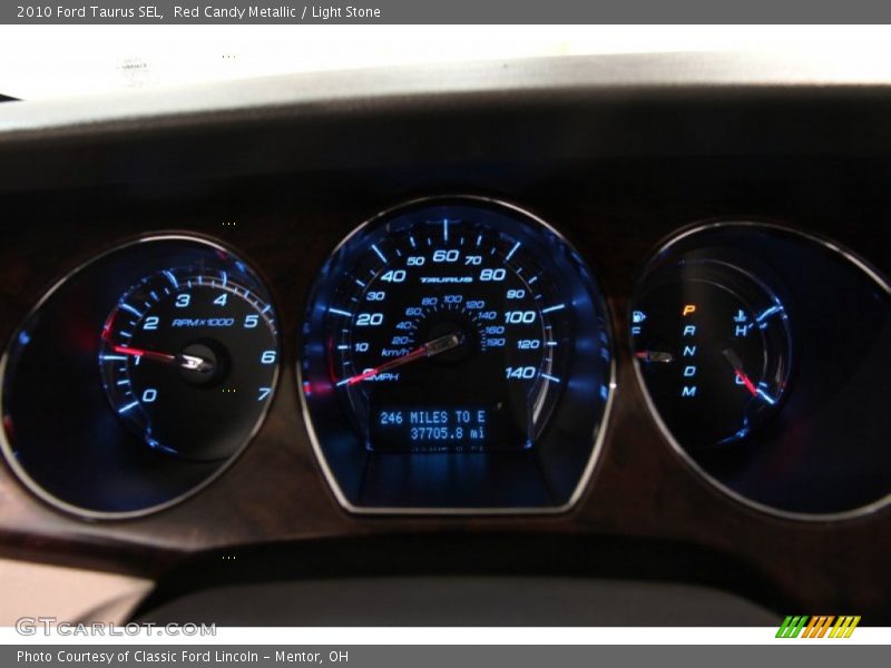 Red Candy Metallic / Light Stone 2010 Ford Taurus SEL