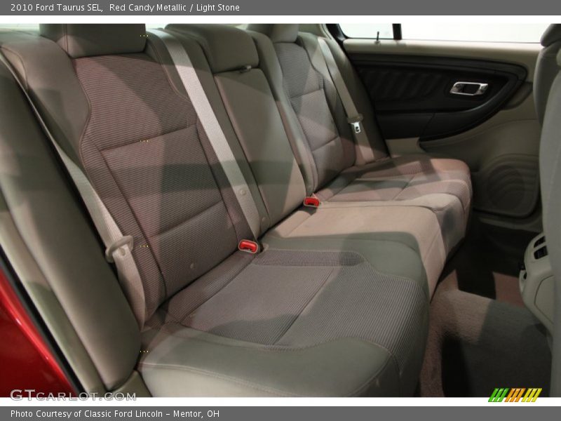 Red Candy Metallic / Light Stone 2010 Ford Taurus SEL