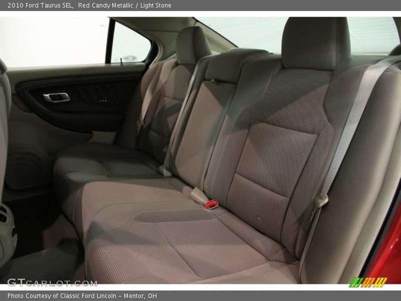 Red Candy Metallic / Light Stone 2010 Ford Taurus SEL