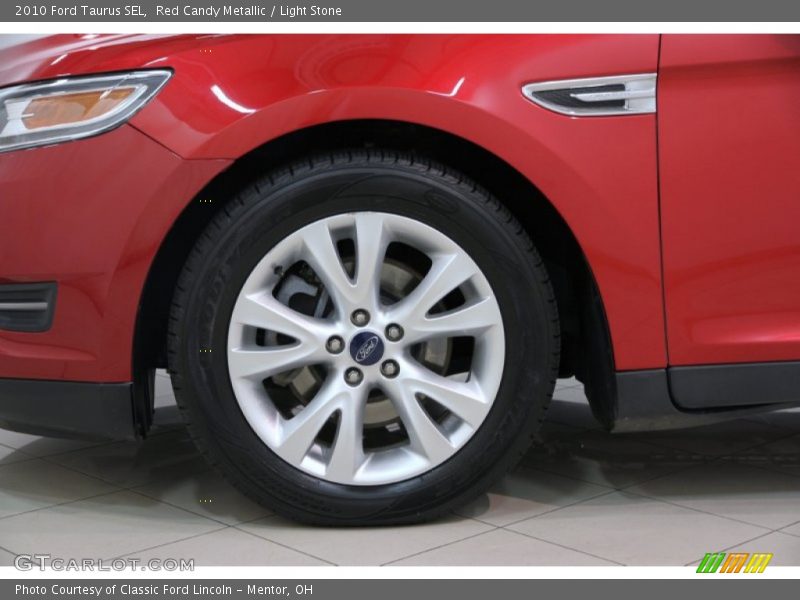 Red Candy Metallic / Light Stone 2010 Ford Taurus SEL