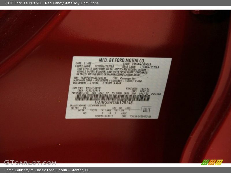 Red Candy Metallic / Light Stone 2010 Ford Taurus SEL