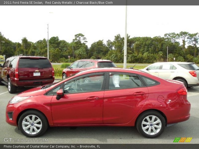 Red Candy Metallic / Charcoal Black/Blue Cloth 2011 Ford Fiesta SE Sedan