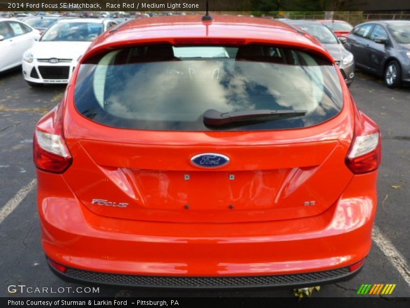 Race Red / Medium Light Stone 2014 Ford Focus SE Hatchback
