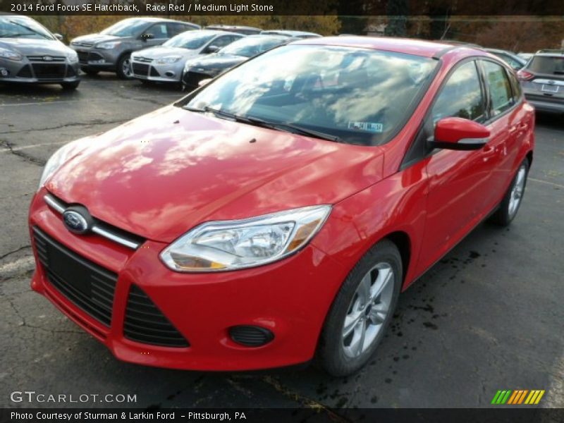 Race Red / Medium Light Stone 2014 Ford Focus SE Hatchback