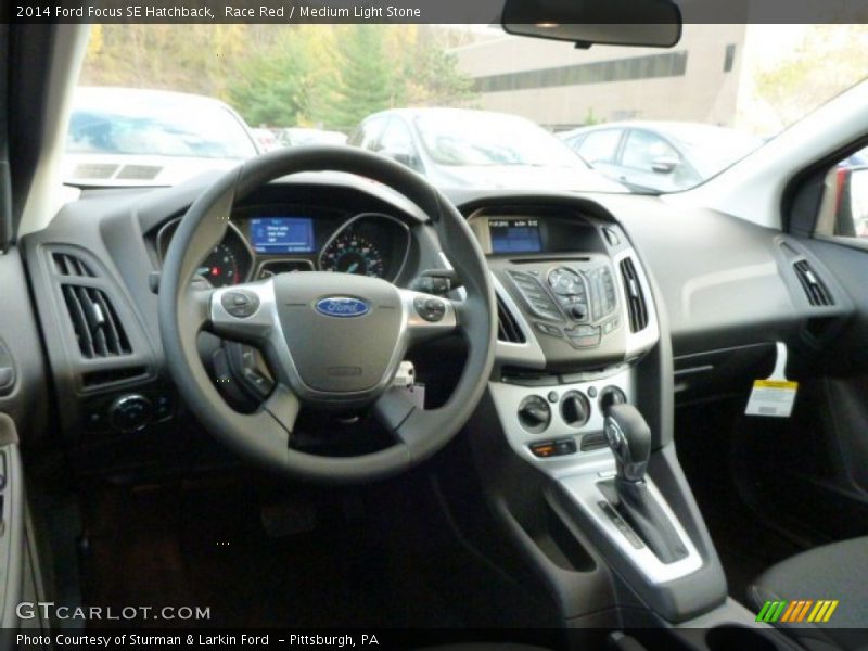Race Red / Medium Light Stone 2014 Ford Focus SE Hatchback