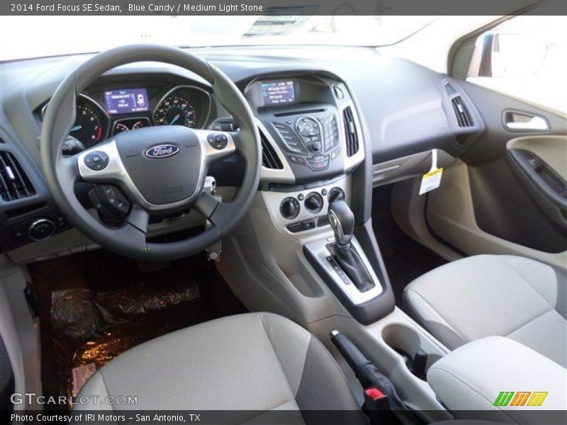 Blue Candy / Medium Light Stone 2014 Ford Focus SE Sedan