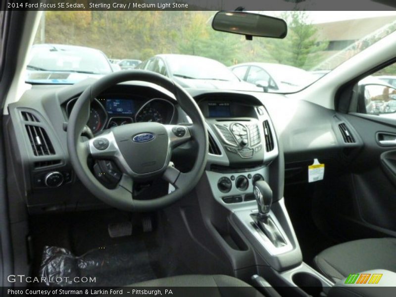 Sterling Gray / Medium Light Stone 2014 Ford Focus SE Sedan