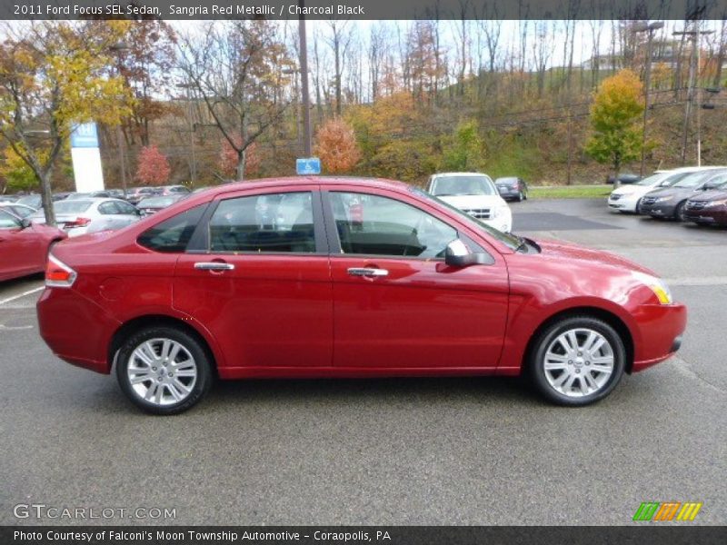Sangria Red Metallic / Charcoal Black 2011 Ford Focus SEL Sedan