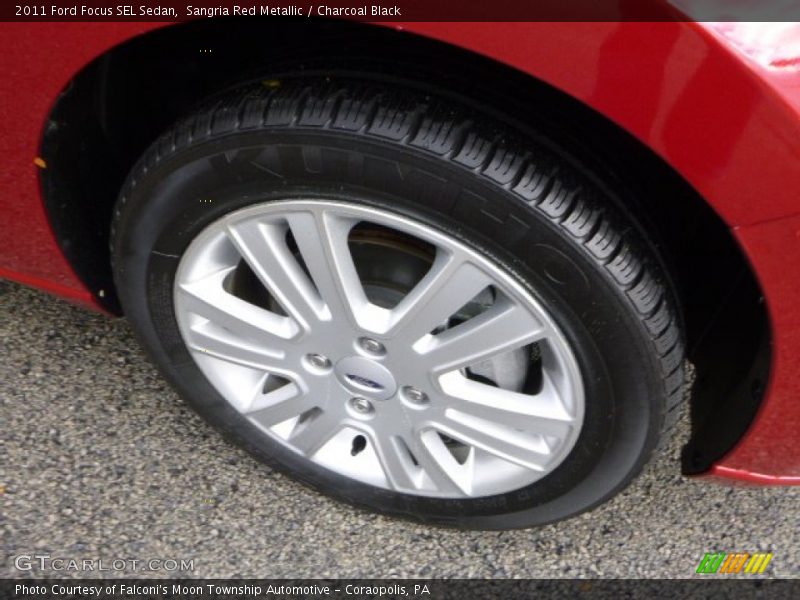 Sangria Red Metallic / Charcoal Black 2011 Ford Focus SEL Sedan