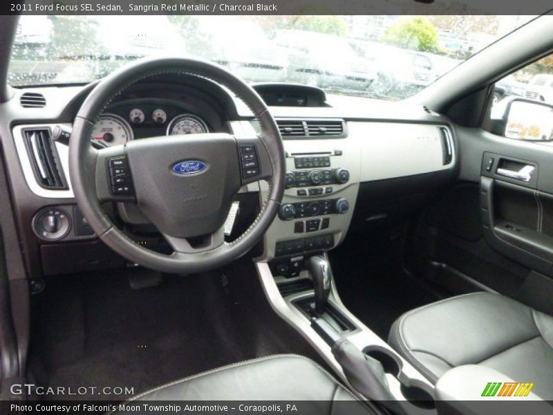 Sangria Red Metallic / Charcoal Black 2011 Ford Focus SEL Sedan