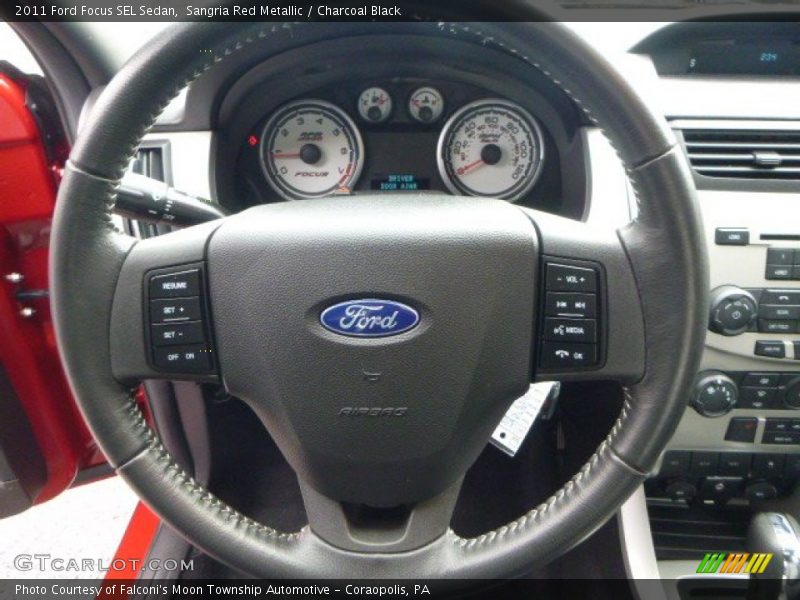 Sangria Red Metallic / Charcoal Black 2011 Ford Focus SEL Sedan