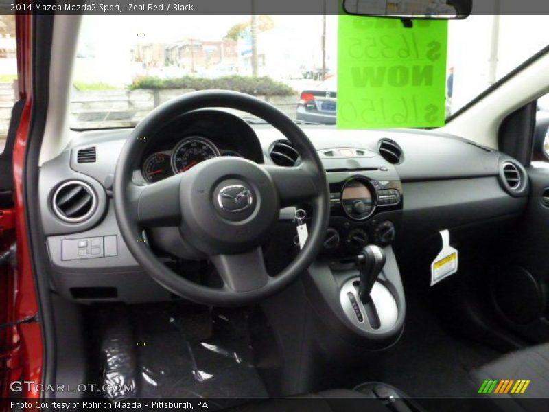 Dashboard of 2014 Mazda2 Sport