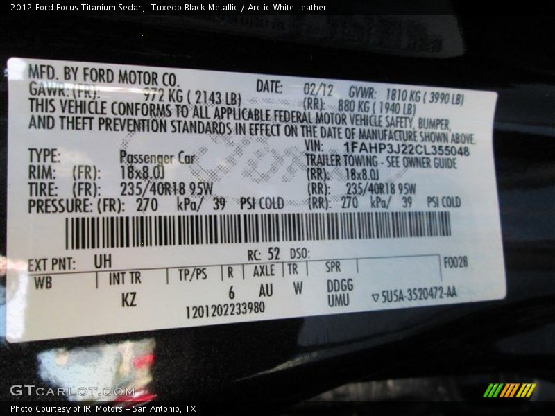 Tuxedo Black Metallic / Arctic White Leather 2012 Ford Focus Titanium Sedan