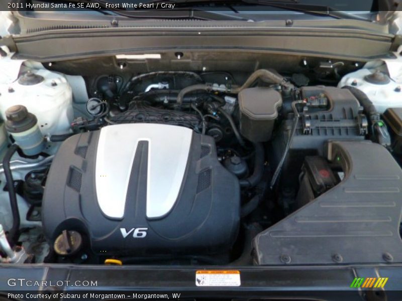Frost White Pearl / Gray 2011 Hyundai Santa Fe SE AWD