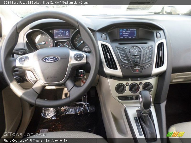 Blue Candy / Medium Light Stone 2014 Ford Focus SE Sedan