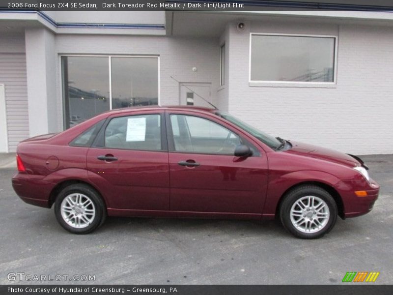 Dark Toreador Red Metallic / Dark Flint/Light Flint 2006 Ford Focus ZX4 SE Sedan