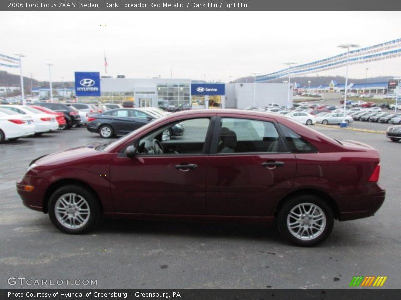 Dark Toreador Red Metallic / Dark Flint/Light Flint 2006 Ford Focus ZX4 SE Sedan