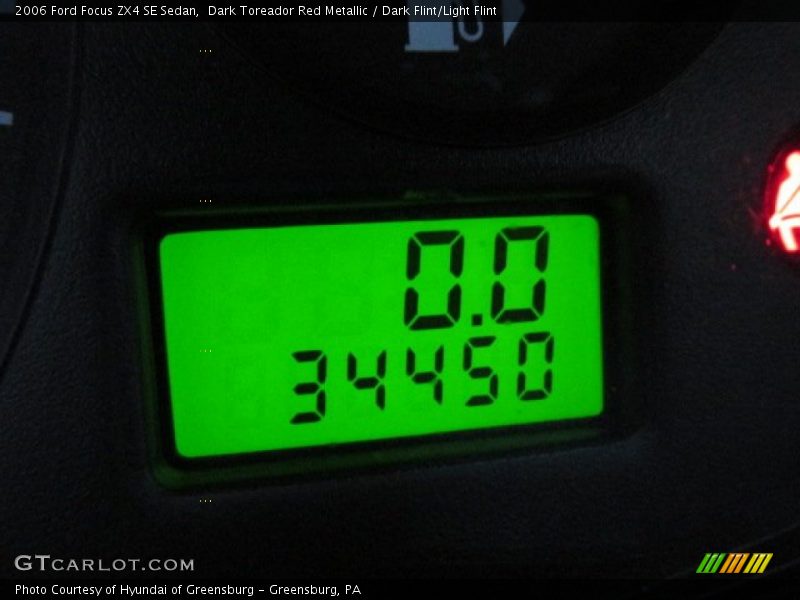 Dark Toreador Red Metallic / Dark Flint/Light Flint 2006 Ford Focus ZX4 SE Sedan