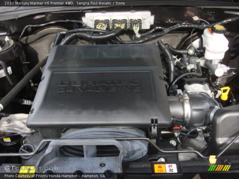 Sangria Red Metallic / Stone 2010 Mercury Mariner V6 Premier 4WD