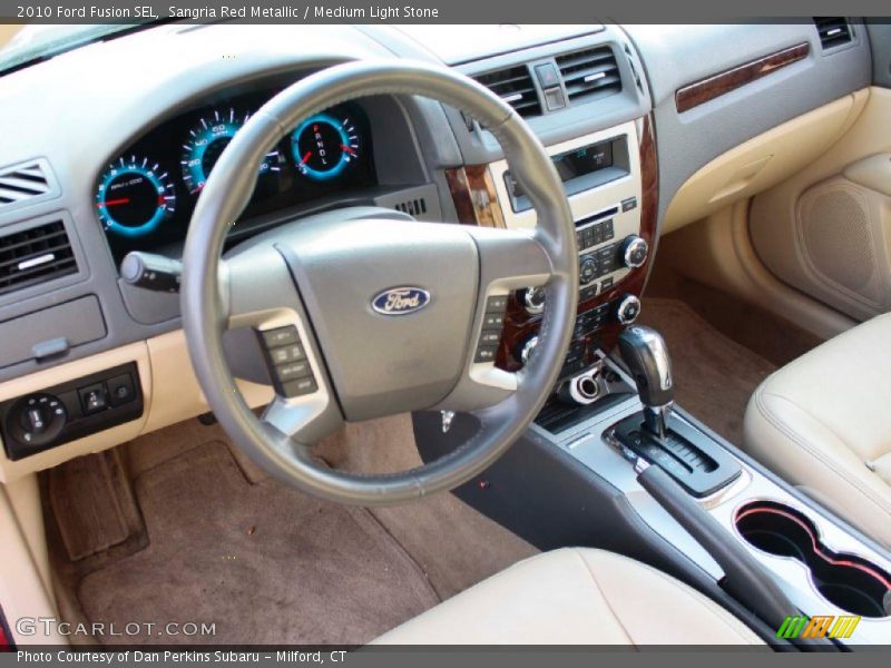 Sangria Red Metallic / Medium Light Stone 2010 Ford Fusion SEL