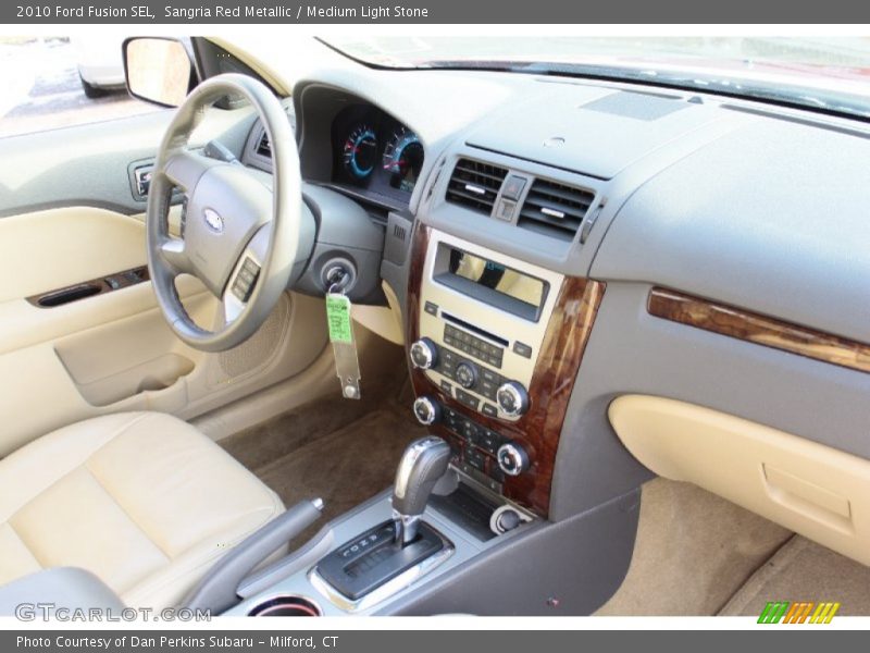 Sangria Red Metallic / Medium Light Stone 2010 Ford Fusion SEL