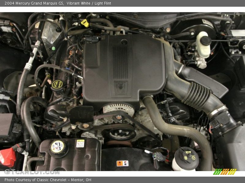 Vibrant White / Light Flint 2004 Mercury Grand Marquis GS
