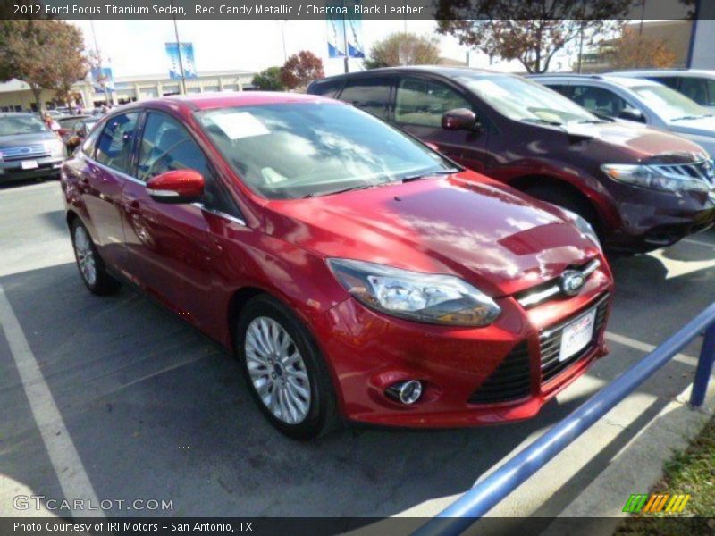 Red Candy Metallic / Charcoal Black Leather 2012 Ford Focus Titanium Sedan