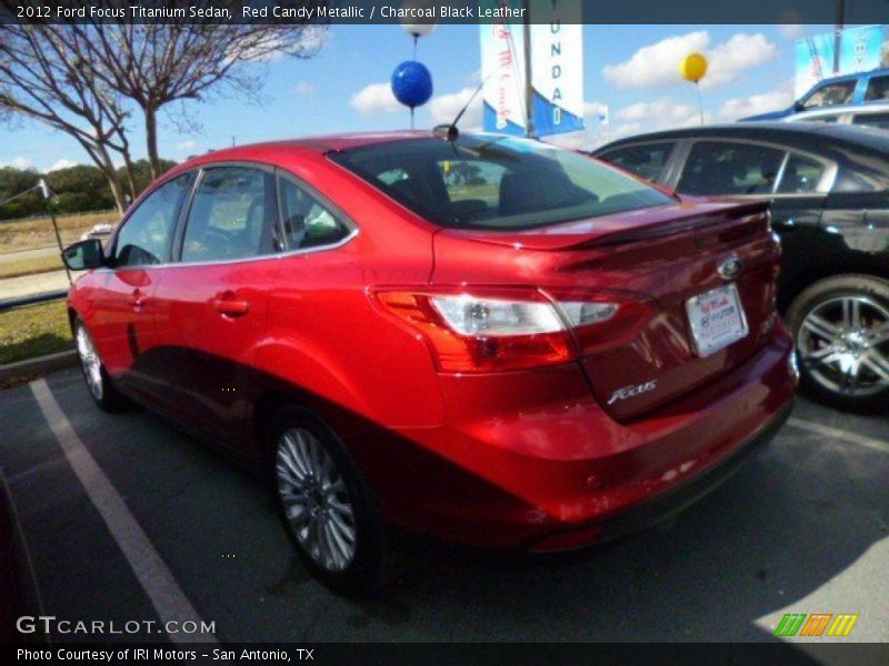 Red Candy Metallic / Charcoal Black Leather 2012 Ford Focus Titanium Sedan