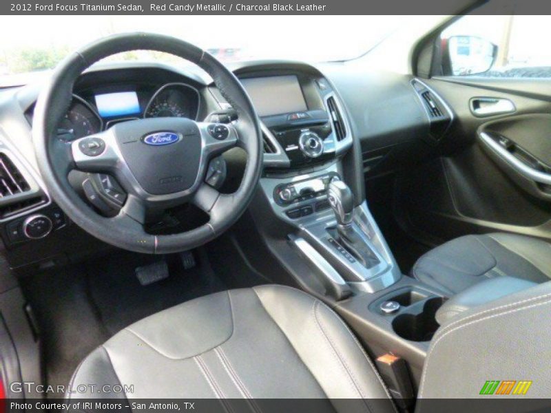 Red Candy Metallic / Charcoal Black Leather 2012 Ford Focus Titanium Sedan