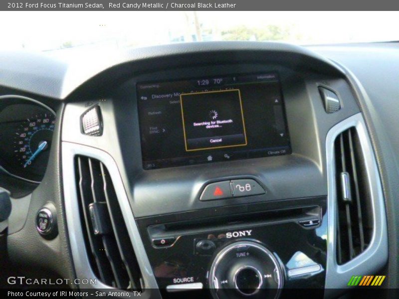 Red Candy Metallic / Charcoal Black Leather 2012 Ford Focus Titanium Sedan